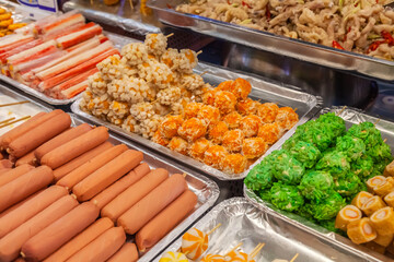 Various Types of Asian Sausages, Meat Balls and Fish Balls on Skewers.