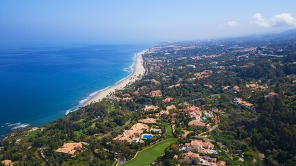 Fototapeta premium Vila SolAn aerial drone view of Vila Sol, a Portuguese tourist village with a backdrop of the sea and golf courses