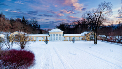 Small colonnade in Marianske Lazne (Marienbad) - snow winter in spa park. Spa architecture - evening colonnade of cold mineral water spring Ferdinand - Czech Republic, Europe