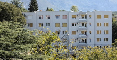 communist era apartment block building in nova gorica, slovenia, europe (yugoslavia history blocky brutalist construction flats) flat real estate eastern european rental rent high rise old roof home © Yuriy T