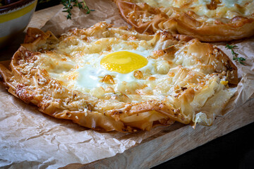 Khachapuri made from filo dough, with egg and melted cheese.
