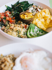 Healthy breakfast dishes with eggs and vegetables