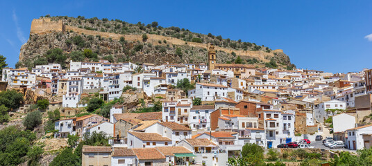 Fototapeta premium Panorama of white houses and church tower on the hill in Chulilla, Spain