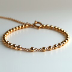 Obraz premium Mockup of a blank elegant gold anklet set against a white background, ideal for jewelry branding, luxury accessories, and fashion presentation.