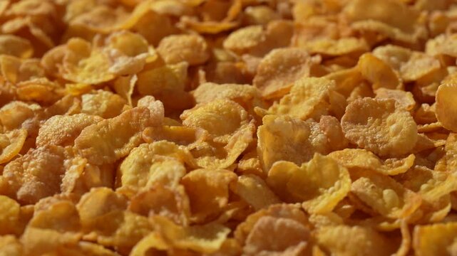 Macro video of corn flakes on rotating disc.