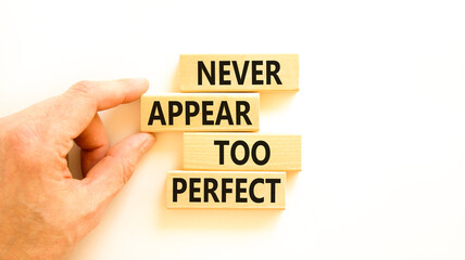 Never appear too perfect symbol. Concept words Never appear too perfect on beautiful wooden blocks. Beautiful white table white background. Business and never appear too perfect concept. Copy space.