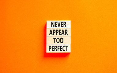 Never appear too perfect symbol. Concept words Never appear too perfect on beautiful wooden blocks. Beautiful orange table orange background. Business and never appear too perfect concept. Copy space.