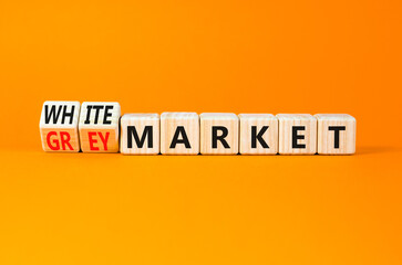 Grey or white market symbol. Concept words Grey market or White market on beautiful wooden blocks. Beautiful orange table orange background. Business grey or white market concept. Copy space.