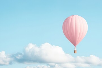 Obraz premium A pink hot air balloon floats leisurely against a bright blue sky with fluffy clouds.