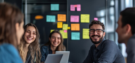 a cheerful person in a collaborative, colorful setting with the team suits campaigns on innovation and teamwork.