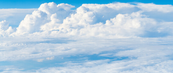 Blue sky with clouds in the sky. Sky clouds background. White cloudy Heaven with soft sun light....