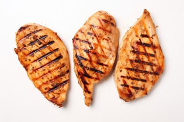 Grilled chicken breast slices top view isolated on white