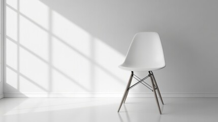 a white chair sitting in a white room