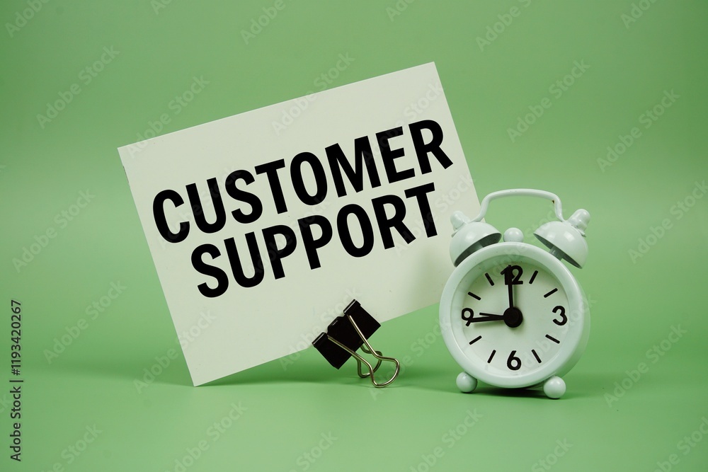 Aufkleber customer support text message on paper card with alarm clock on green background