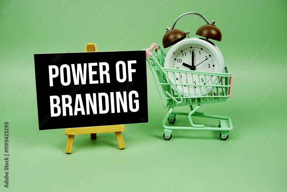 Poster power of branding text message on paper card with alarm clcok and trolley shopping cart on green bac