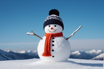 Obraz premium snowman with orange scarf and hat on top of snowy mountain