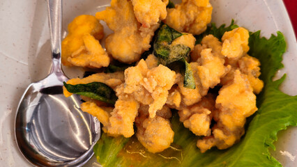 Asian Seafood Dishes: Deep Fried Squid or Calamari on the plate. 