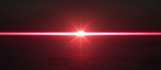 Powerful red laser beam glowing with bright radiance in a dramatic dark background creating a striking sci fi or futuristic visual effect with luminous energy and luminescent illumination