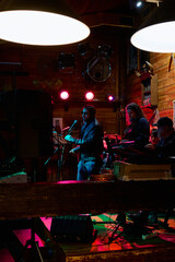 Energetic heavy metal performance at an intimate venue during the late night