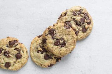 Overhead view of chocolate chip cookies on a white background, top view of homemade chocolate chip cookies