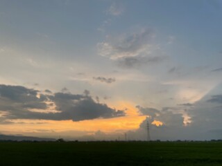 Beautiful sky with natural gradations. Thick clouds in the dusk sky on a winter night. Image of a cloudy sky in the afternoon. View of the night sky with golden light from the evening sun