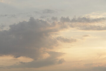 Beautiful sky with natural gradations. Thick clouds in the dusk sky on a winter night. Image of a cloudy sky in the afternoon. View of the night sky with golden light from the evening sun