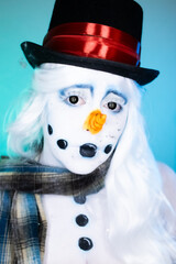 Portrait of a woman wearing artistic snowman makeup, Christmas.