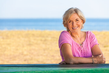 Portrait Happy Senior Woman Sitting Outside
