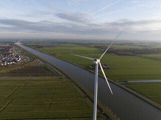 WInd turbine in the country side of The Netherlands. Clean and green sustainable energy production....