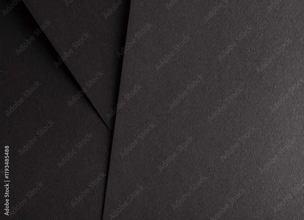 Poster charcoal black paper background with overlapping layers and a smooth, grainy texture. bold dark tone
