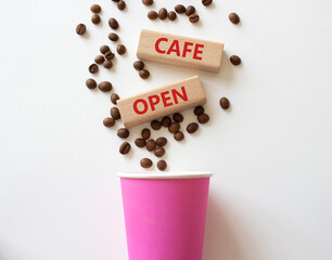 Cafe Open symbol. Concept word Cafe Open on wooden blocks. Beautiful white background with coffee cup. Business and Cafe Open concept. Copy space