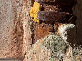 Textured decay: rusty metal, peeling paint, and weathered surfaces in urban environment