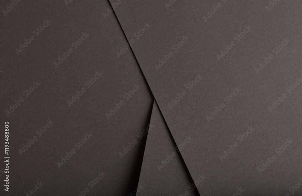 Aufkleber charcoal gray paper background with overlapping layers and a smooth, matte texture. dark tones and a