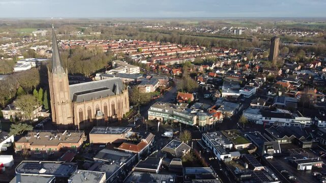 Raalte, the Netherlands - January 10th 2025: Aerial footage of the town center. Drone flying backwards whilst slowly ascending to high altitude.