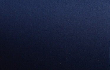 Midnight blue paper background with a smooth, matte texture and subtle grainy details. Bold dark...