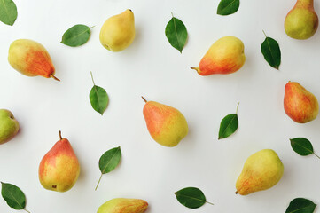 Light autumn background. Ripe yellow fragrant pears and grapes. Thanksgiving background. Fruits on a light background.