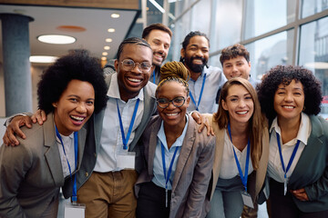 Obraz premium Portrait of happy multiracial business team at convention center looking at camera.