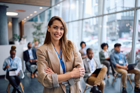 Portrait of confident public speaker during business conference looking at camera.