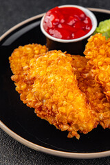 Chicken nuggets in breaded deep fried fresh tasty food dish delicious gourmet food background on the table rustic food top view copy space