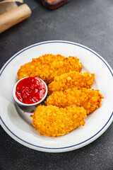 Chicken nuggets in breaded deep fried fresh tasty food dish delicious gourmet food background on the table rustic food top view copy space