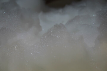 Close-Up of Shimmering Soap Foam and Bubbles in Soft Lighting