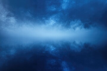 Obraz premium Serene nightscape: Starry sky reflected in calm, misty water.