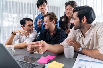 Group of diverse office worker employee working together on strategic business marketing planning in corporate office room. Positive teamwork in business workplace concept. Prudent