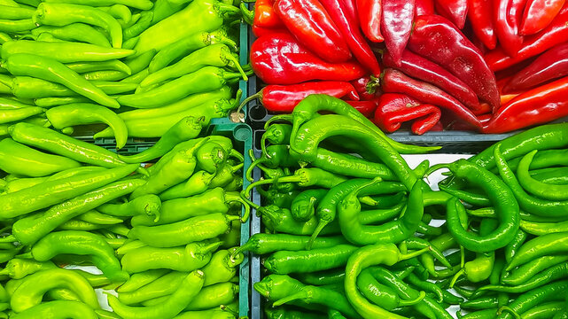 Colorful display of fresh peppers at a market, symbolizing food prices and trends