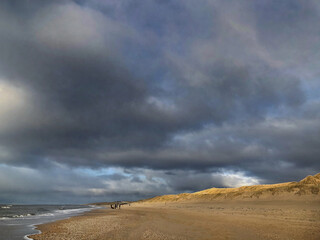 North Sea coast and beach at Julianadorp Noord Holland Netherlands. Coastal area. Clouds and dunes.