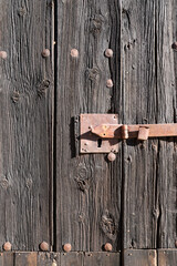 Wrought iron door lock on wooden door