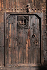 Vintage door with trim ornaments and wrought iron details