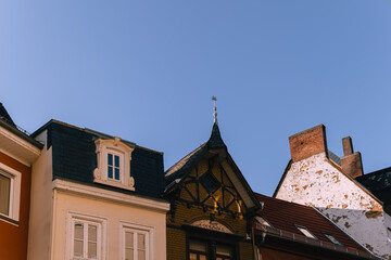 Obraz premium Charming architectural details of historic buildings against a clear blue sky in a European town