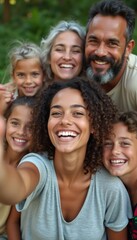 Obraz premium A vibrant family portrait showcases a diverse group of six smiling individuals, radiating happiness and warmth. The image captures the essence of togetherness, with children and adults sharing