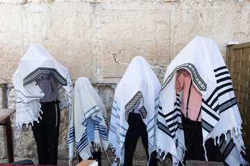 Cohanim or Jewish priests cover their heads with their prayer shawls and recite a special blessing for God's protection of  the Jewish people.